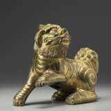 A gilt bronze Buddhist lion - фото 2