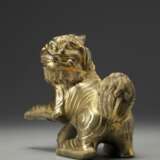 A gilt bronze Buddhist lion - фото 4