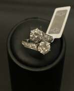 Overview. Platinum ring with diamonds and synthetic moissanites