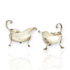 A pair of George II and III silver creamers