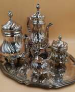 Metal. Beautiful tea-coffee service