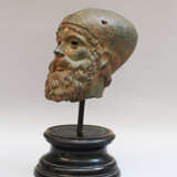 Male Bronze head of a bearded man with hat - фото 1