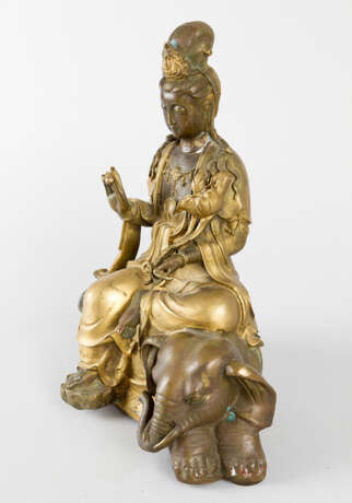 Guanyin sitting on elephant with lotus and bowl in her hands - photo 3