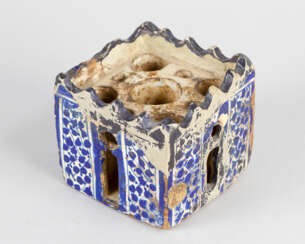 Spanish or North-African inkwell in shape of a tower with round and oval openings on each side and five holes inside