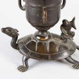 Asian candlestick in form of a flower with leaves on a vase with fantastic animals - photo 2