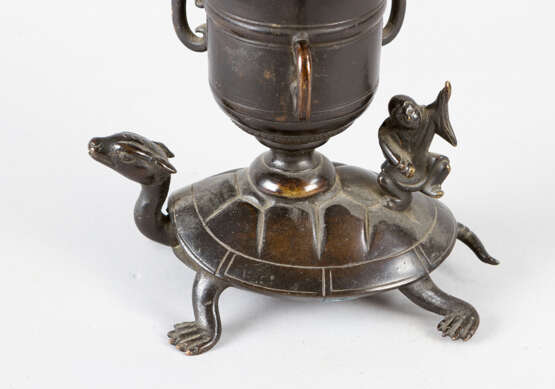 Asian candlestick in form of a flower with leaves on a vase with fantastic animals - фото 2