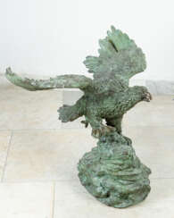 Monumental bronze eagle with stretched wings on naturalistic base
