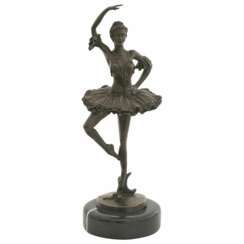 Ballerina bronze sculpture of a dancing woman on marble base.