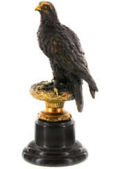The figure of an eagle on a round base made of marble