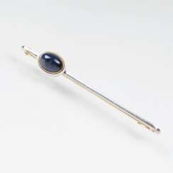Russian tie pin with a sapphire Cabochon