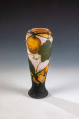 Vase mit Kürbisfrucht