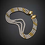 Collier a tre fili di perle con distanziatori e chiusura a fiocco in oro giallo - Foto 1
