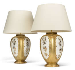A PAIR OF PARCEL-GILT PORCELAIN VASES, MOUNTED AS LAMPS
