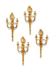 A SET OF FOUR FRENCH ORMOLU THREE-LIGHT WALL-LIGHTS 'A CORS DE CHASSE'