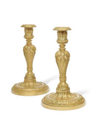 A PAIR OF FRENCH ORMOLU CANDLESTICKS