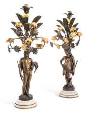 A PAIR OF NAPOLEON III ORMOLU AND PATINATED-BRONZE SIX-LIGHT FIGURAL CANDELABRA