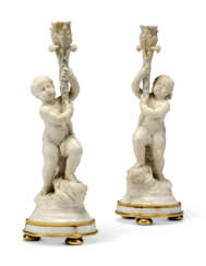 A PAIR OF RESTAURATION FIGURAL MARBLE CANDLESTICKS