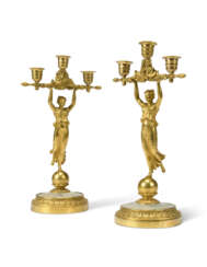 A PAIR OF CHARLES X ORMOLU AND MOTHER-OF-PEARL 'PALAIS-ROYAL' THREE-LIGHT CANDELABRA