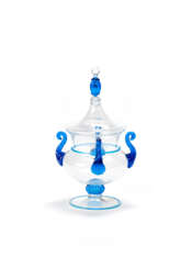 Composer with four twisted handles in crystal glass with applications in transparent light blue glass