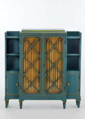 Novecento bookcase in light blue painted wood made for a girl's room and composed of a central showcase and lateral bodies with open shelves and cabinet