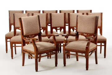 Ten chairs and two déco armchairs in solid walnut structure decorated with vegetable carvings and grooves