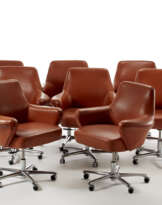 * Lot of eight small armchairs on wheels covered in Siena-colored leather