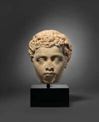 A ROMAN MARBLE PORTRAIT HEAD OF A BOY