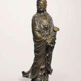 A LARGE SILVER-INLAID BRONZE FIGURE OF GUANYIN - photo 1