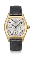 CARTIER A FINE AND RARE 18K GOLD TONNEAU-SHAPED AUTOMATIC PE...