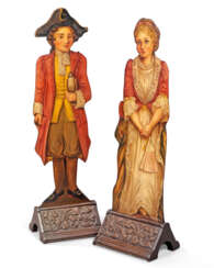 A PAIR OF PAINTED OAK DUMMY BOARDS DEPICTING A BOY AND A GIR...