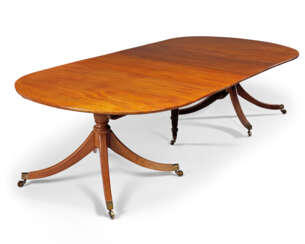A LATE GEORGE III MAHOGANY EXTENDING DINING-TABLE