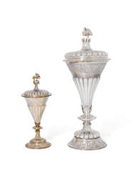 A GEORGE V SILVER CUP AND COVER IN THE FORM OF THE CIRENCEST...