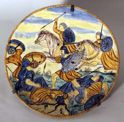Italian ceramic dish painted in the centre with a battle scene