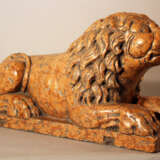 Italian rosso verona stone lion in sitting position, sculpted in naturalistic shape with some drill holes and claws in the front - photo 1