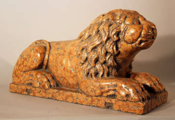 Italian rosso verona stone lion in sitting position, sculpted in naturalistic shape with some drill holes and claws in the front