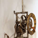 Iron clock movement with later bronze dial with Roman numbers and copper finger - photo 1