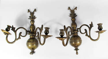 Pair of polish bronze wall brackets, each with two branches decorated with open work and scrolls, ending in one spout