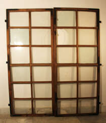 Pair of baroque casement windows, each with 12 sections, partly with their original mouth blown glass, partly with later glass and missing parts