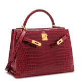 Hermes. A SHINY ROUGE H POROSUS CROCODILE SELLIER KELLY 32 WITH GOLD... - photo 2