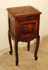 A French Provencal small chest on four high shaped legs with scroll endings