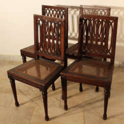 A set of four Louis XVI dining chairs, each with four fluted and turned legs