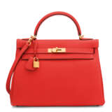 Hermes. A CAPUCINE TOGO LEATHER RETOURNÉ KELLY 32 WITH GOLD HARDWARE... - фото 1