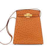 Hermes. A COGNAC OSTRICH KELLY SPORT 24 BAG WITH GOLD HARDWARE - фото 1