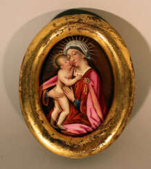 Enamel medallion in oval form showing Maria with Jesus child with gilded halos in red dress, white cape, in front of brown background