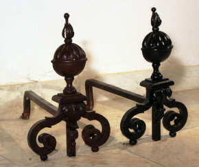 Pair of baroque andirons, iron forge with volutes, leaves and acanthus ending