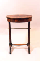 Small French directoire oval working table on two round column feet, each with two extended legs and bronze connection, one drawer and oval top