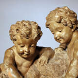 French sculpted terracotta group with two boys playing with water by a source, on integrated stepped base - фото 2