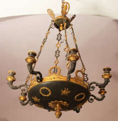 An Empire chandelier in bowl shape with 8 scrolled branches and fluted spouts