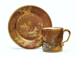 A SEVRES PORCELAIN FAUX LACQUER BROWN-GROUND CUP AND REPLACE...