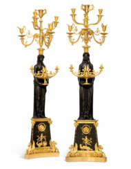 A PAIR OF MONUMENTAL EMPIRE ORMOLU AND PATINATED-BRONZE SEVE...